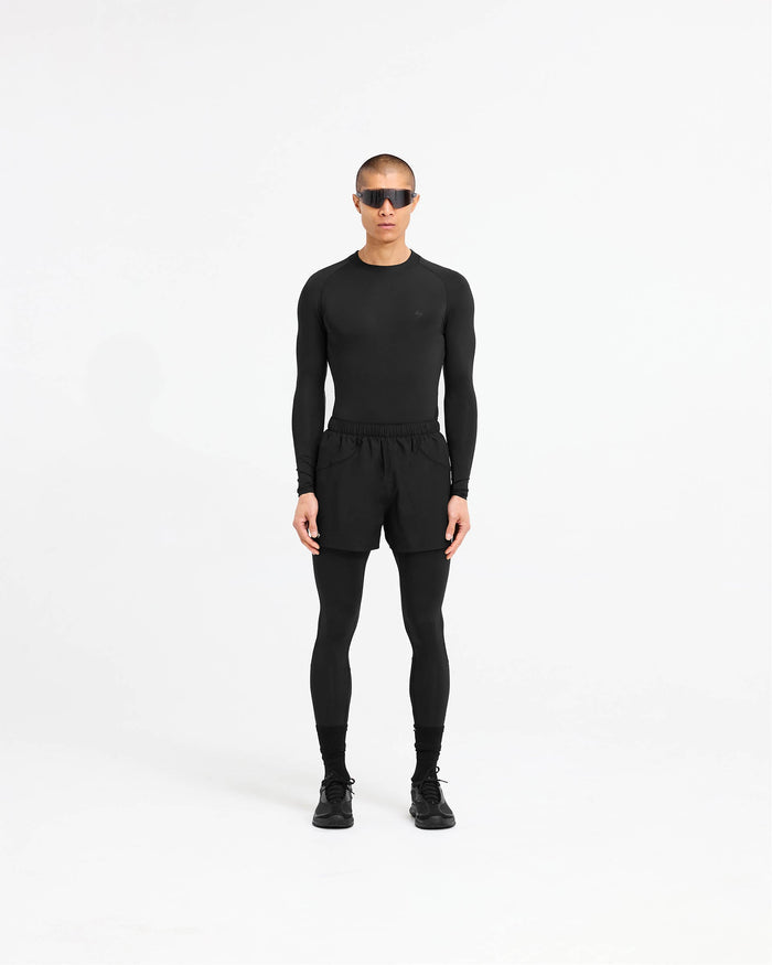 Man wearing black leggings on a plain white background | 247 Compound Legging in Black | Full length leggings with elasticated waistband and quick drying technology | 247 Pants | Represent Clo