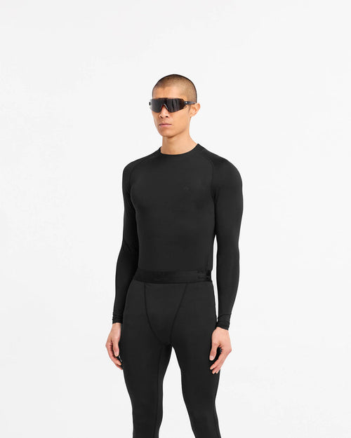 Back product image of a mens black long sleeve t-shirt on a plain white background | 247 Compound Long Sleeve T-Shirt in Black | Antibacterial long sleeves with external flatlock stitching | 247 T-Shirts | Represent Clo