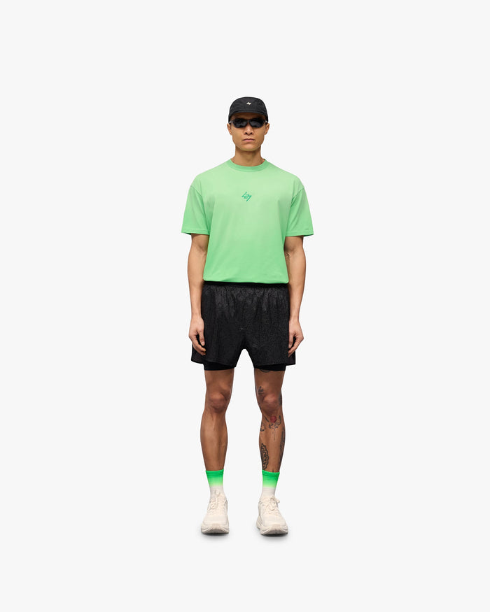 Man wearing black 2-in-1 run shorts on a plain white background | 247 Contour 2-In-1 Run Shorts in Black | Shorts with inner legging and zip pockets | 247 Shorts | Represent Clo