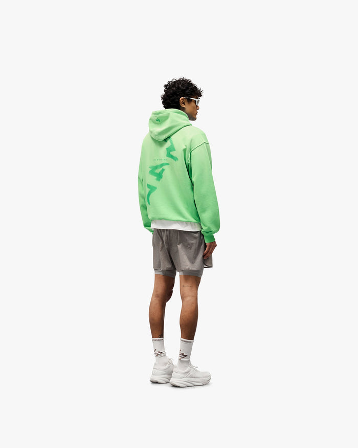 Man wearing grey 2-in-1 run shorts on a plain white background | 247 Contour 2-In-1 Run Shorts in Titanium | Run shorts with inner legging and zip pockets | 247 Shorts | Represent Clo
