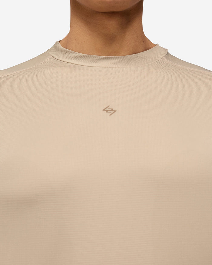 Man wearing a grey technical t-shirt on a plain white background | 247 Contour Run T-Shirt in Pebble | Breathable quick-drying running t-shirt | 247 T-Shirts | Represent Clo