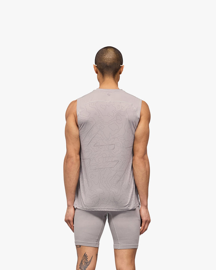 Man wearing a grey running tank on a plain white background | 247 Contour Run Tank in Titanium | Breathable sweat-wicking running tank | 247 T-Shirts | Represent Clo
