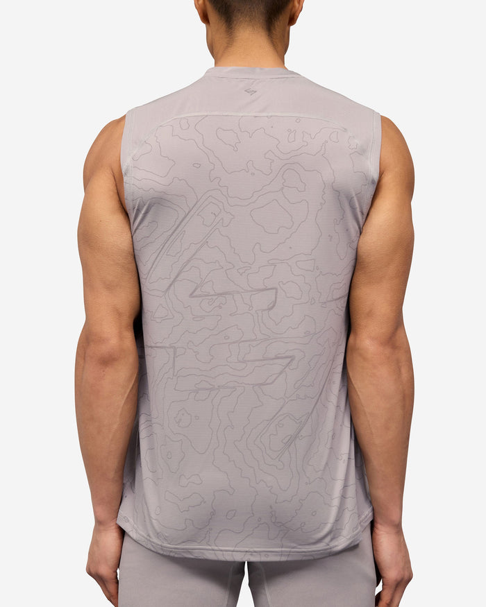 Man wearing a grey running tank on a plain white background | 247 Contour Run Tank in Titanium | Technical mesh running tank with contour print | 247 T-Shirts | Represent Clo