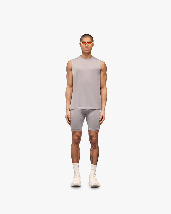 Man wearing a grey running tank on a plain white background | 247 Contour Run Tank in Titanium | Breathable and sweat wicking running tank | 247 T-Shirts | Represent Clo
