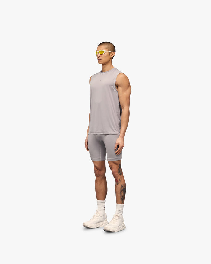 Man wearing a grey tank on a plain white background | 247 Contour Run Tank in Titanium | Breathable and sweat-wicking running tank | 247 T-Shirts | Represent Clo