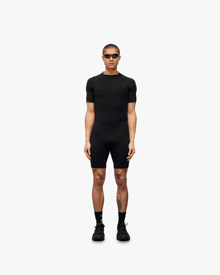 Man wearing black seamless shorts on a plain white background | 247 DNA Seamless Shorts in Black | Compression support seamless shorts | 247 Shorts | Represent Clo