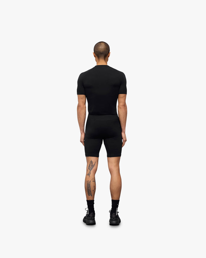 Man wearing black seamless shorts on a plain white background | 247 DNA Seamless Shorts in Black | Seamless shorts with flatlock stitching | 247 Shorts | Represent Clo