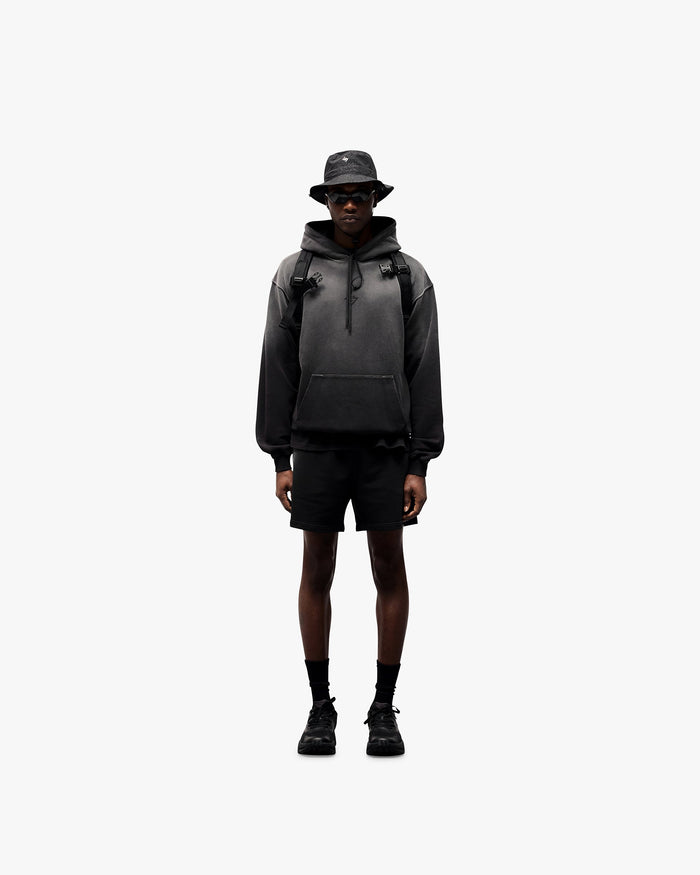 Man wearing an oversized black hoodie on a plain white background | 247 Motion Oversized Hoodie in Black | Oversized hoodie with ribbed hem and cuffs | 247 Hoodies | Represent Clo