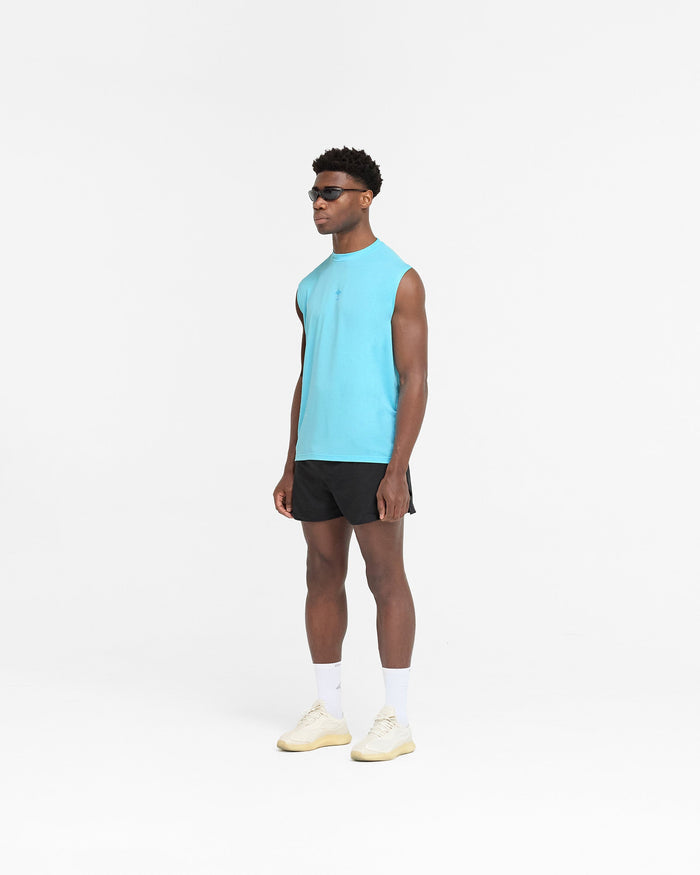 Man wearing a blue tank top on a plain white background | 247 Oversized Tank in Ultra Blue | Oversized tank top with 4-way stretch | 247 T-Shirts | Represent Clo