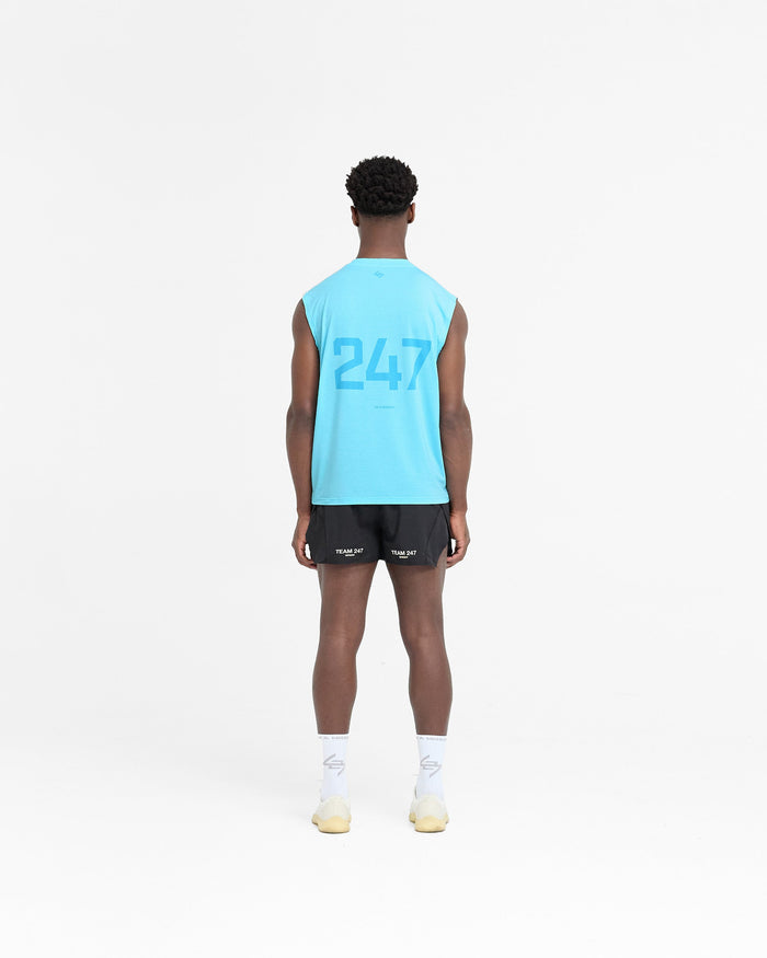 Man wearing a blue tank top on a plain white background | 247 Oversized Tank in Ultra Blue | Technical fabric tank top with 4-way stretch | 247 T-Shirts | Represent Clo