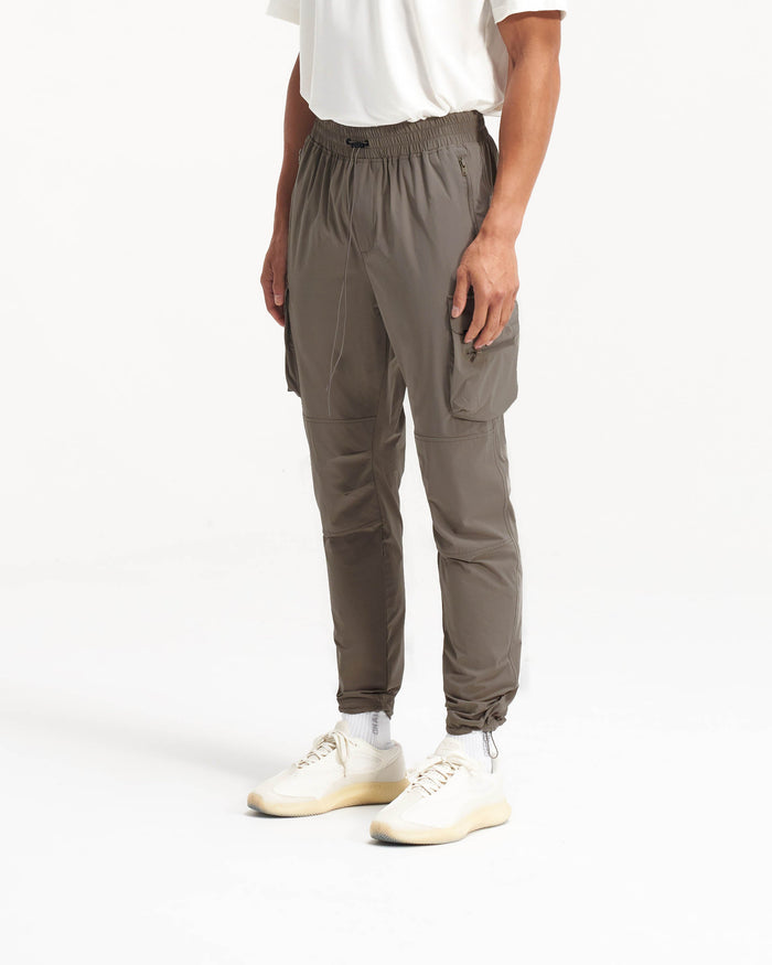Back product image of mens olive pants on a plain white background | 247 Pant in Olive | Cargo pants with spacious zip side pockets | 247 Pants | Represent Clo