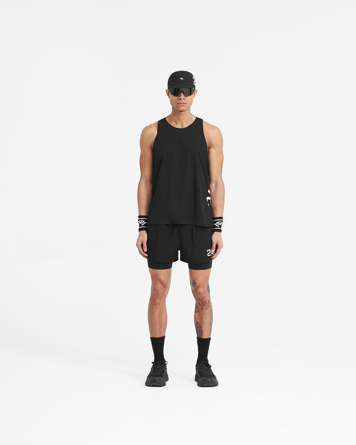 Man wearing a black training singlet on a plain white background | 247 Singlet in Jet Black | High performance perforated vest | 247 T-Shirts | Represent Clo