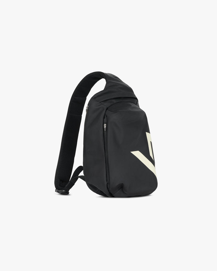Back product image of a mens black sling bag on a plain white background | 247 Sling Bag in Black | Sling bag with 2 zip pockets and adjustable padded strap | 247 Accessories | Represent Clo