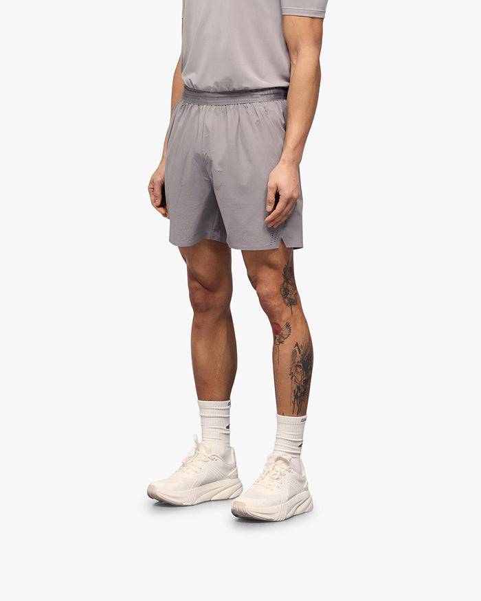 Back product image of mens grey shorts on a plain white background | 247 Training Shorts in Titanium | Performance shorts with zip pockets and perforation detailing | 247 Shorts | Represent Clo