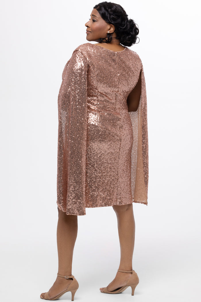 Sydney's Closet CE2609 in rose gold.

Plus size sequin rose gold metallic short party dress. V-neckline, bra-friendly straps with attached cape sleeve detail, princess silhouette, slim A-line skirt. at knee-length.