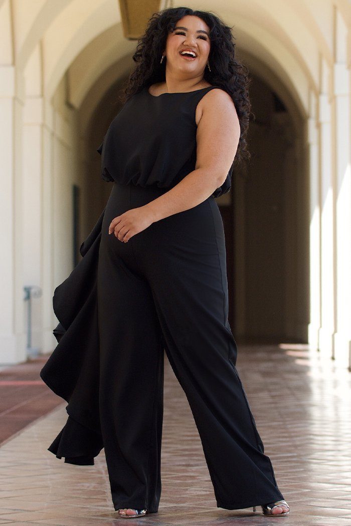 CE2014 by Sydney's Closet french crepe fabric jumpsuit with flounce on side of bodice and pant with center back zipper and scoop neckline, bra friendly straps and sleeveless available in red, black and ivory.