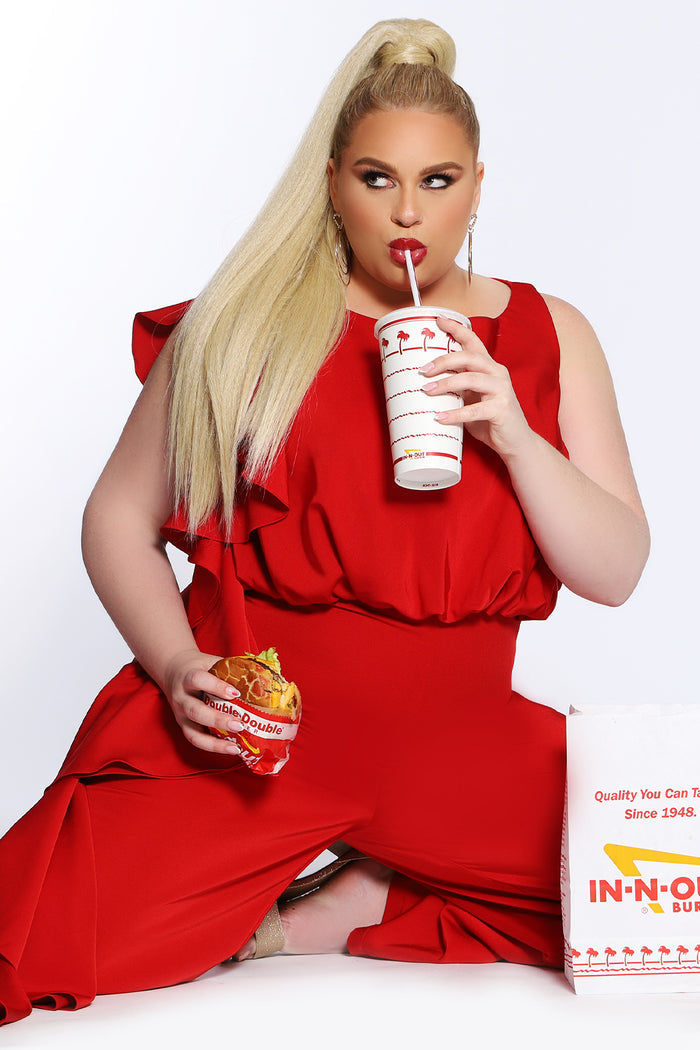 CE2014 by Sydney's Closet french crepe fabric jumpsuit with flounce on side of bodice and pant with center back zipper and scoop neckline, bra friendly straps and sleeveless available in red, black and ivory.