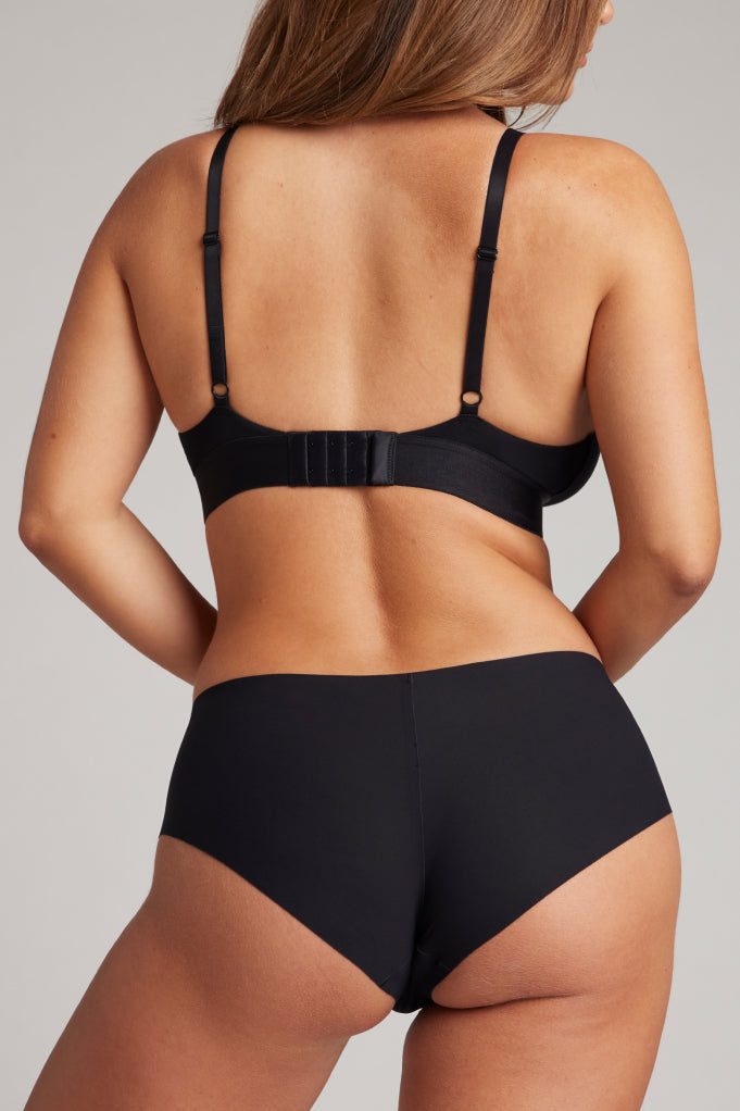 Black boy shorts, back view with elastic waistband and smooth leg openings