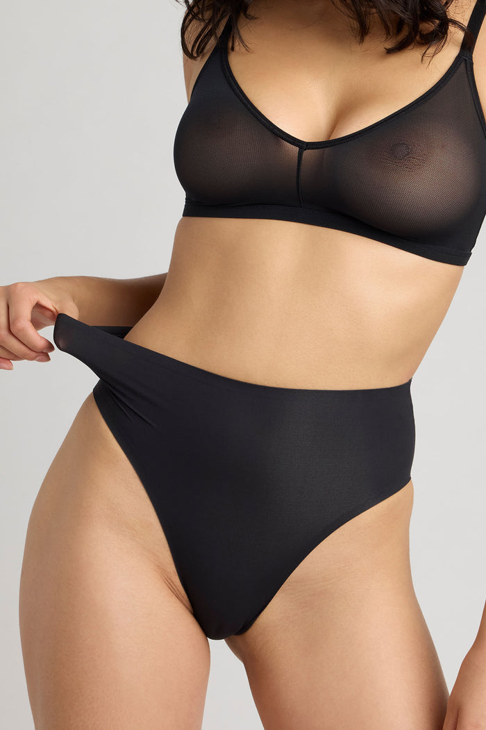 High rise black brief with seamless waistband, full coverage front