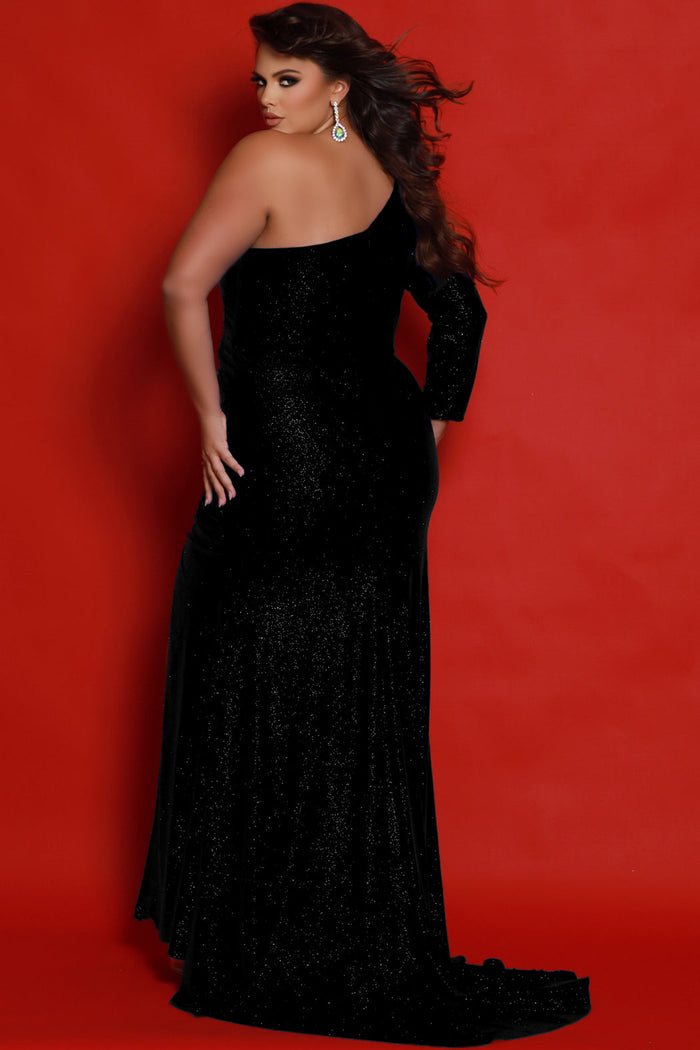 Johnathan Kayne for Sydney's Close JK2410 Black. Slim/Fitted Silhouette, Stretch sparkle lycra, One-shoulder neckline, Long sleeve, AB beaded applique with fringe on shoulder, Ruched bodice, Asymmetrical ruched waistline, Long invisible center back zipper, Slim skirt, High ruched slit, Sweep train