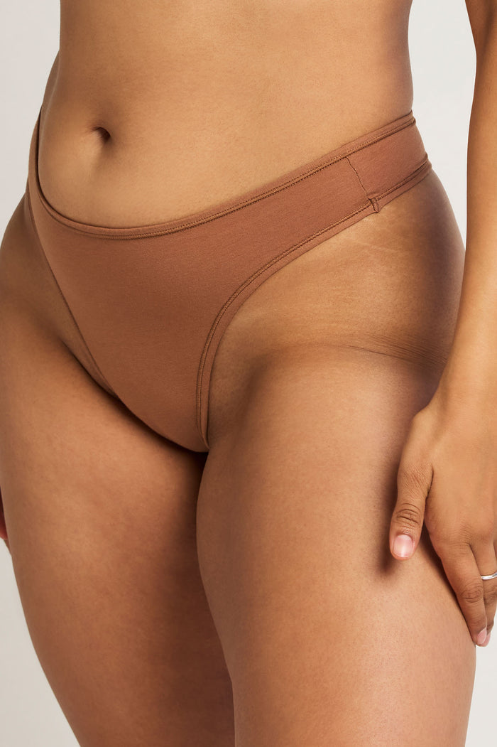 Cotton thong in deep brown with wide waistband and minimal back coverage