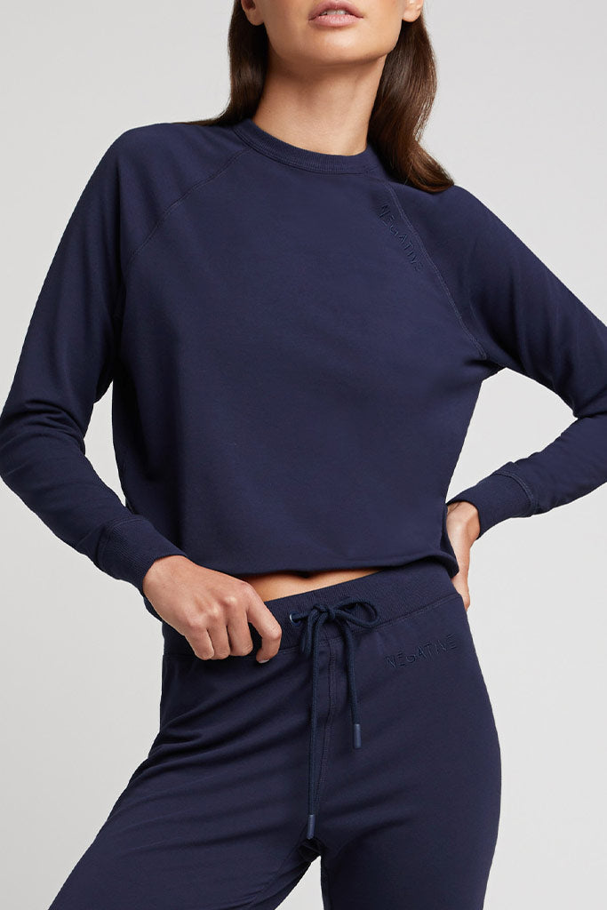 Navy crewneck sweatshirt with matching jogger pants, long sleeves and drawstring waist