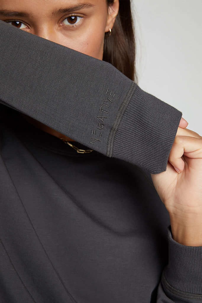 Embroidered Negative logo above the right cuff[Ksenia S]