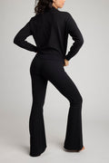 Black flare pants with fitted waist and wide flared bottom hem