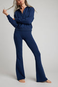 Navy flare pants with elastic waistband and straight-to-wide leg opening