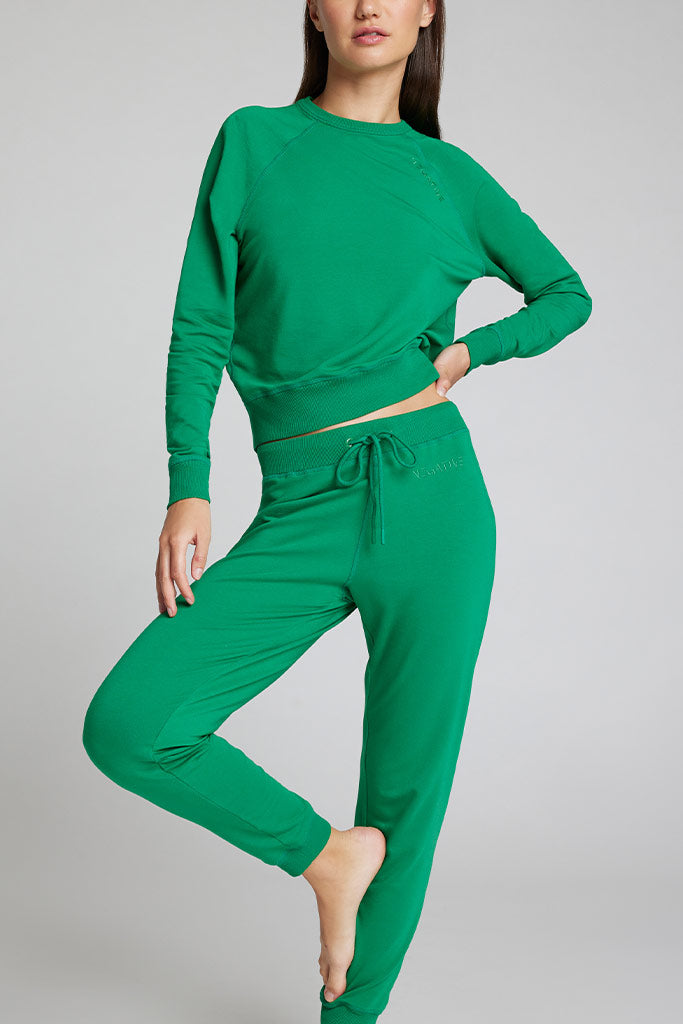 Green jogger pants with drawstring waist and tapered cuffs