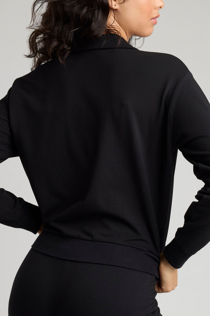 Black club pullover back view with long sleeves and V-neck collar