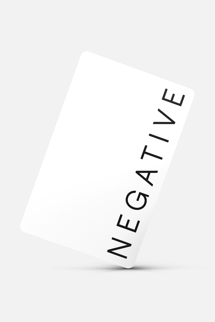 White digital gift card with 'NEGATIVE' text printed diagonally