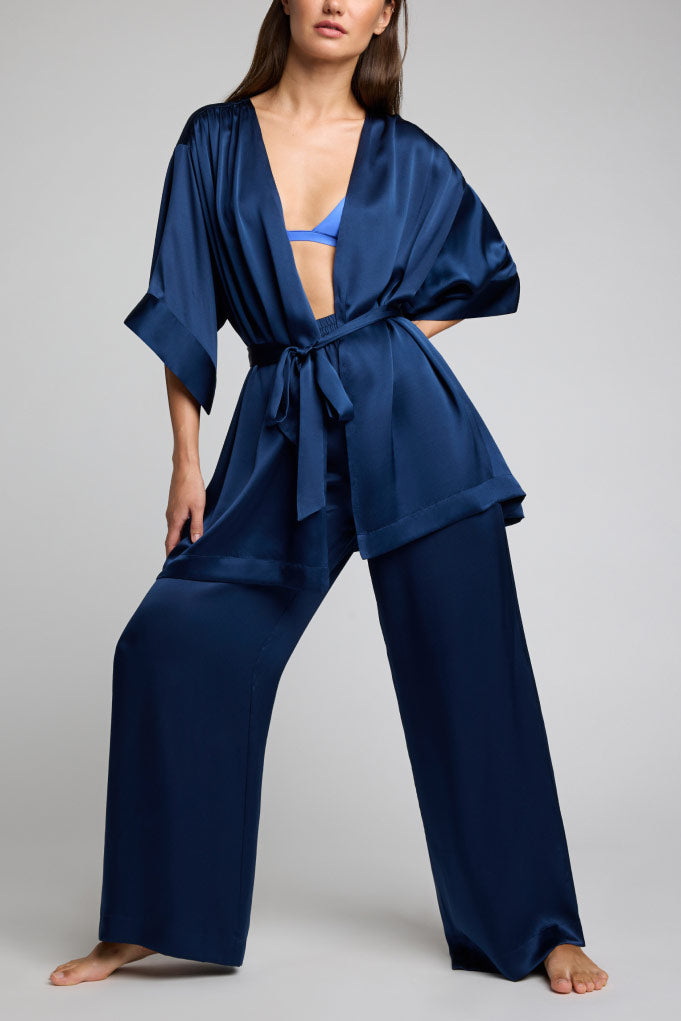 Navy silk robe with wide-leg pants; open V-neck, tie waist, loose kimono sleeves