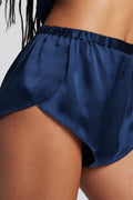Navy silk mini shorts side view with ruched elastic waistband