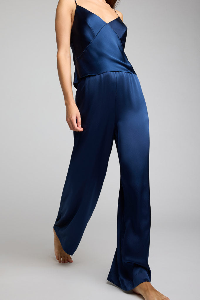 Navy wide-leg silk track pants with elastic waist and flowing drape