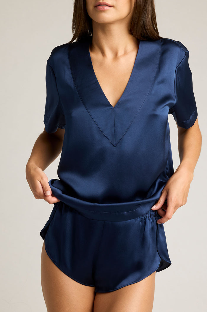 Navy washable silk V-neck top with short sleeves and relaxed drape