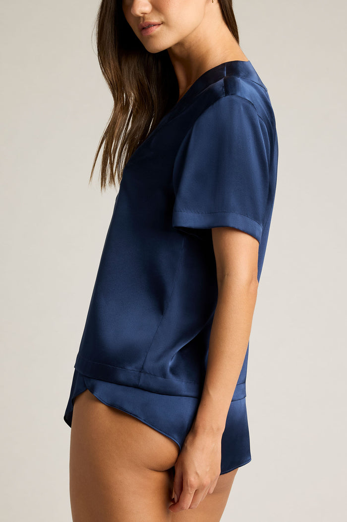 Navy washable silk V-neck top with short sleeves and side drape