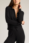 Black featherweight cashmere polo with button placket, collar, and drawstring waist
