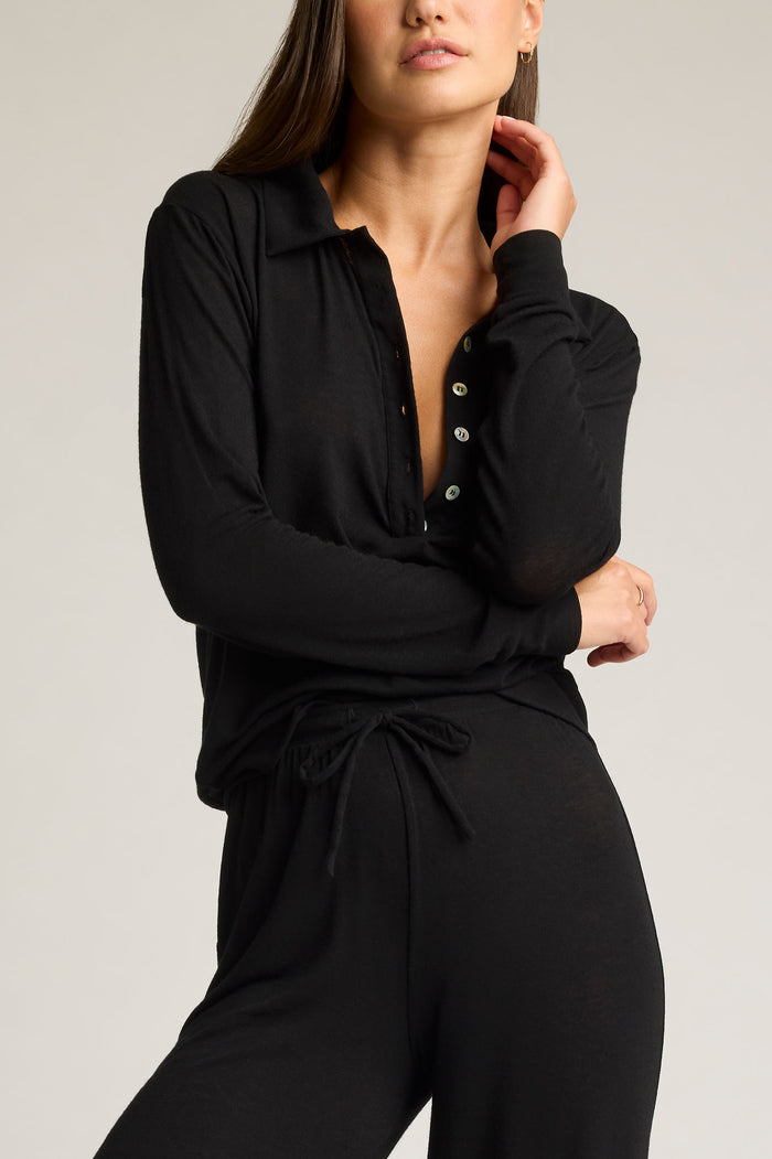 Black featherweight cashmere polo with button placket, collar, and drawstring waist