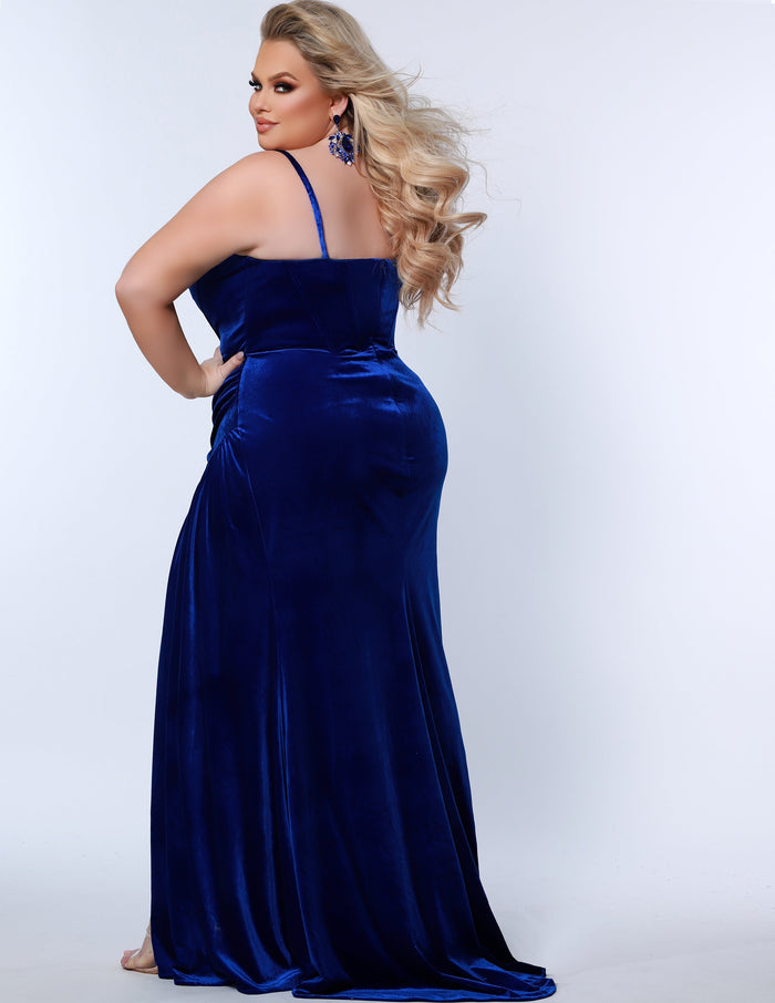 Sydney’s Closet SC7342 Royal blue. Slim/Fitted silhouette, strapless with optional spaghetti straps. Modified Basque waist, exposed corset boning on bodice and a ruched waist. Stretch velvet, with high slit and sweep train.
