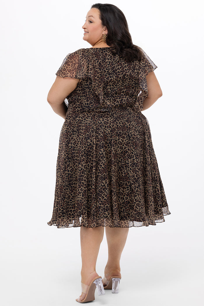 Celebrations by Sydney's Closet style CE2605 in animal print. 

Knee length plus size animal print dress.  V-neck, short flutter sleeves, natural waistline, pockets and ruffles on bodice princess seams. Made from printed chiffon and light satin lining. Center back zipper.
