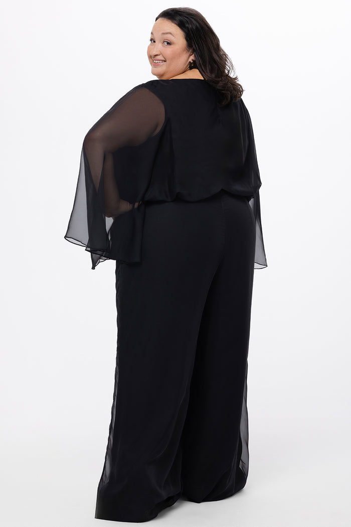 Celebration's by Sydney's Closet style CE2608 in black. 

Scoop neckline, long cape sleeve chiffon jumpsuit. Wide leg pants, blouson bodice and natural waistline. High scoop back with center back zipper.
