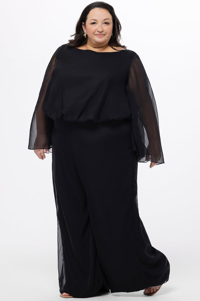 Celebration's by Sydney's Closet style CE2608 in black. 

Scoop neckline, long cape sleeve chiffon jumpsuit. Wide leg pants, blouson bodice and natural waistline. High scoop back with center back zipper.