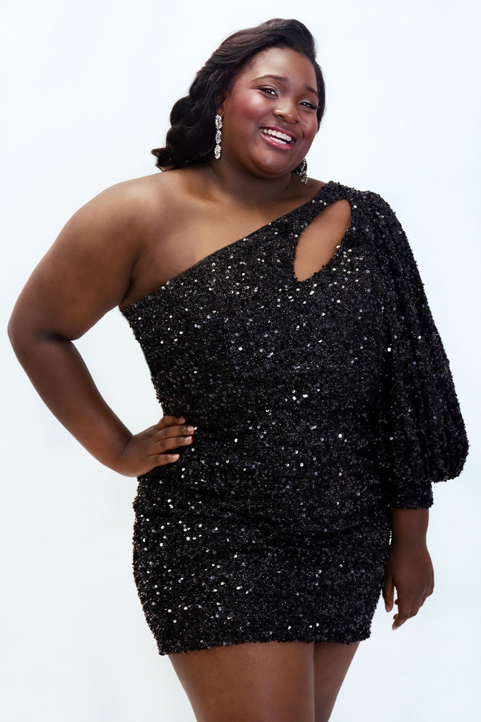 This is SC8133 in our Sydney's Closet Homecoming collection. This plus size party dress comes in black, blue, purple, and red! This dress has a one shoulder long sleeve pouf sleeve, a cutout bodice, and a natural waistline. This fitted all over sequin dress has the spotlight as the most perfect dress for this homecoming season!