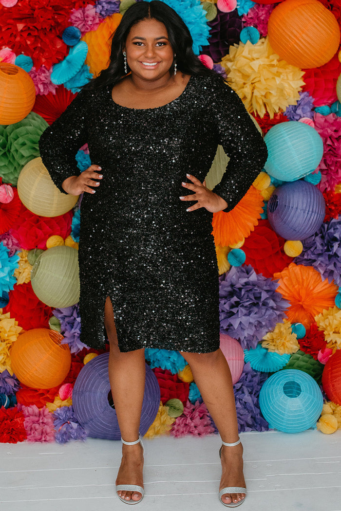 Sydney's Closet Style SC8113 plus size sequin party dress with long sleeves, scoop nekcline and slit. Available in blue, red, black and forest green.