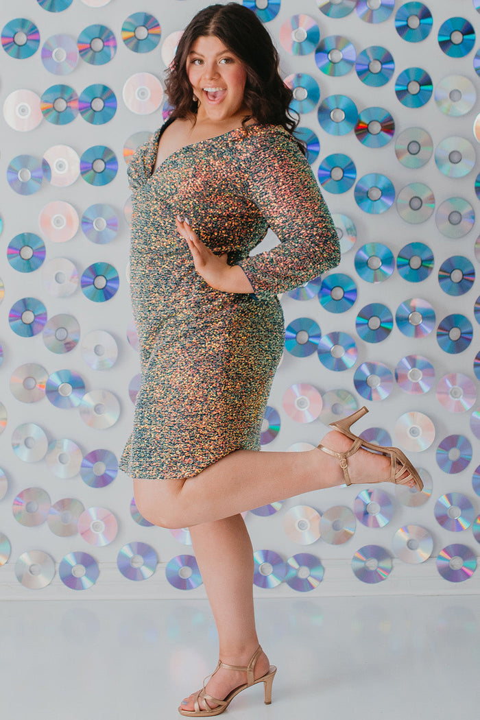 Sydney's CLoset SC8111 short plus size part y  dress with deep V-neckline, long sleeves and high slit. Multi dimensional sequins and ruched bodice.
