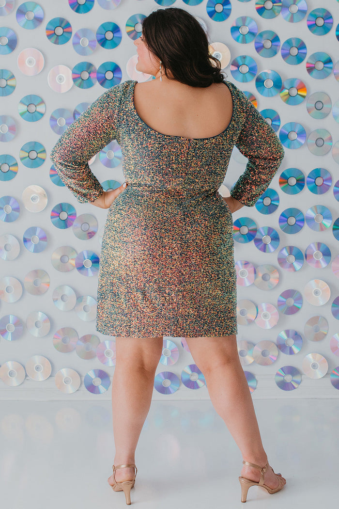 Sydney's CLoset SC8111 short plus size part y  dress with deep V-neckline, long sleeves and high slit. Multi dimensional sequins and ruched bodice.