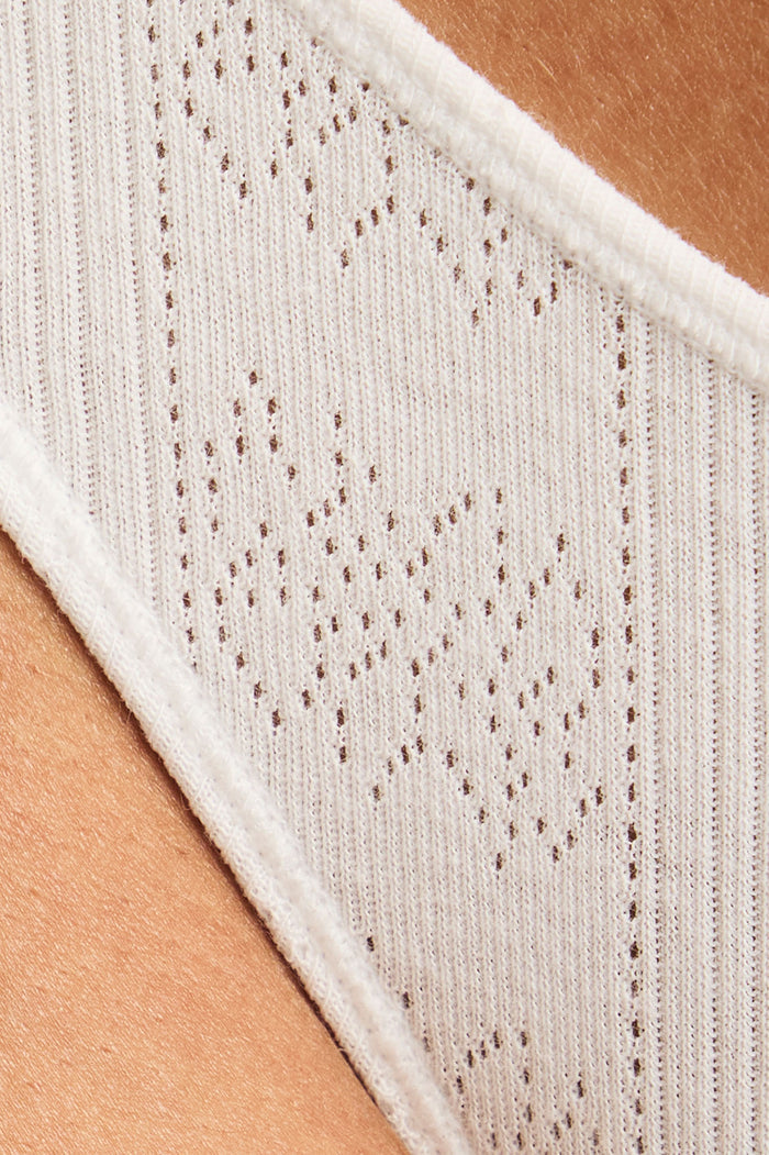 White pointelle thong fabric with perforated diamond texture