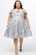 Celebrations by Sydney's Closet CE2610 in Light Blue Floral. 

Plus size knee-length party dress in metallic light blue floral brocde print. Off-the-shoulder neckline, natural waistline and A-line skirt with pockets.