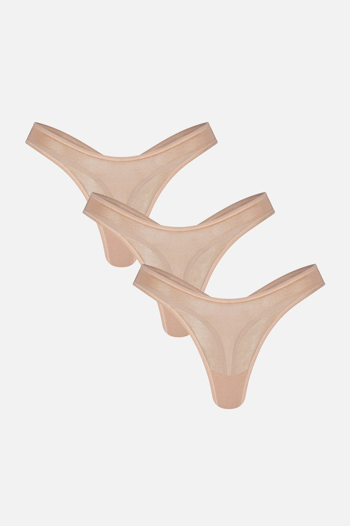 Three black thong-style underwear pieces arranged overlapping on a plain light gray background.